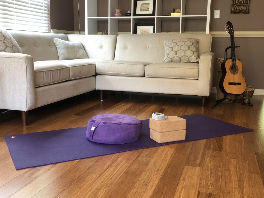 Yoga mat and props set up for private in home yoga class